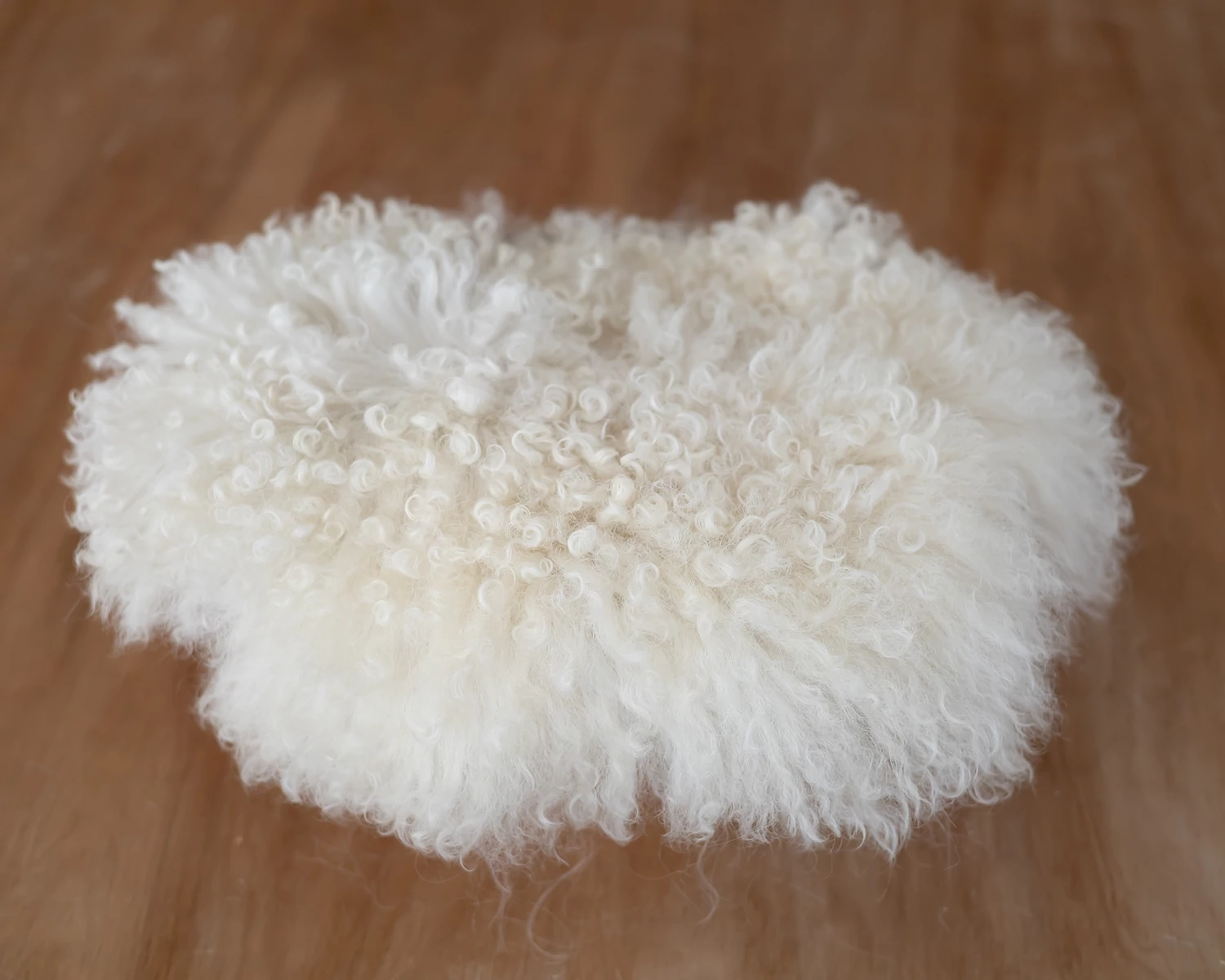 Ivory white genuine curly fokati fur – large oval